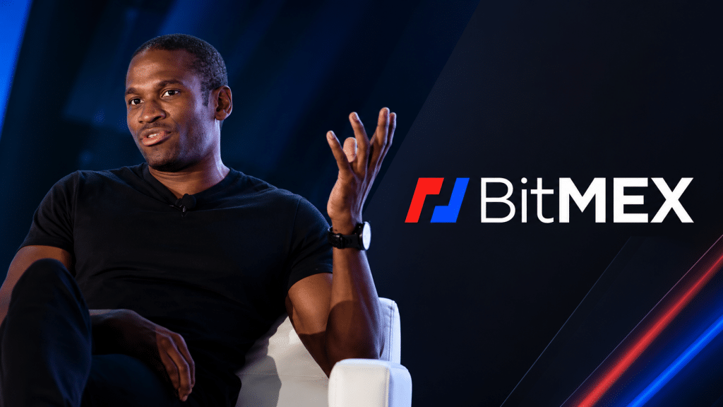 BitMEX co-founder Arthur Hayes pictured alongside the BitMEX logo
