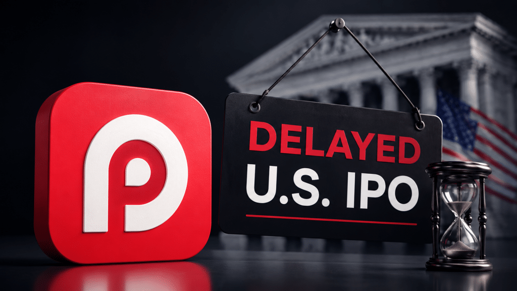 RedotPay logo beside a delayed U.S. IPO sign and hourglass, with a U.S. financial backdrop.